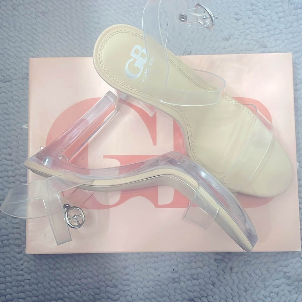 These shoes go with just about anything, size 9 1/2 clear strap up heels.